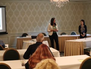 Photo of IEI faculty presenting a workshop.